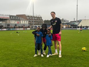 The kids with some footballers