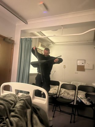 A man breaking a chair