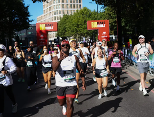 A crowd of people running in central London