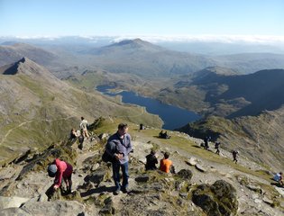 People trekking on Mount Snowdon
